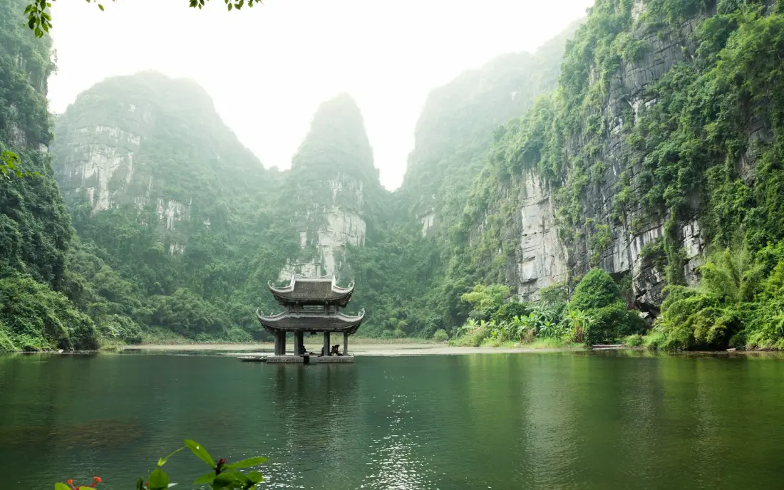A pagoda among the karst mountains of Ninh Binh, Vietnam